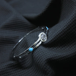 Silver Tone Vintage-Inspired Cuff with Blue Stone Detail - rangeeen.pk
